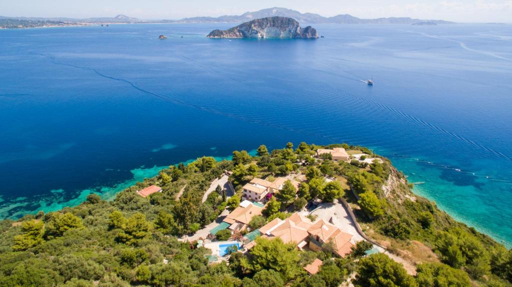 an aerial view of an island in the water at Villas Cavo Marathia in Keri
