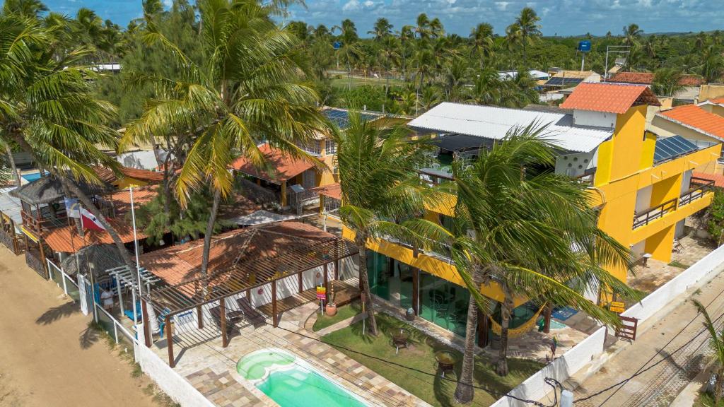 an aerial view of a resort with a swimming pool at Pousada La Bella Luna in Porto De Galinhas