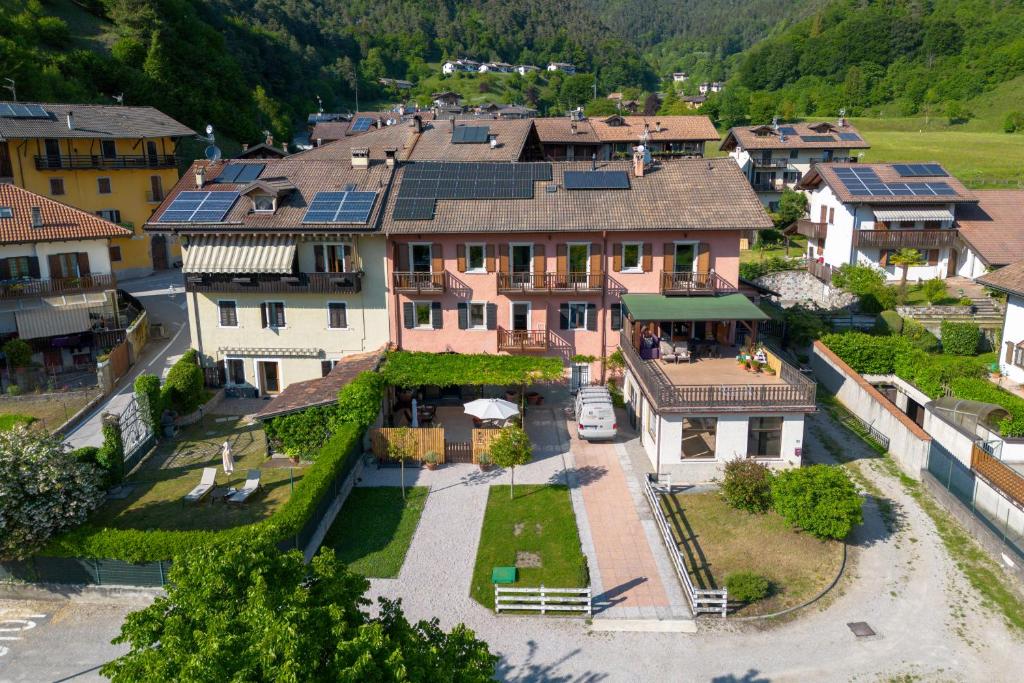 an aerial view of a house with solar panels on its roofs at Ledro Lake Suites in Ledro
