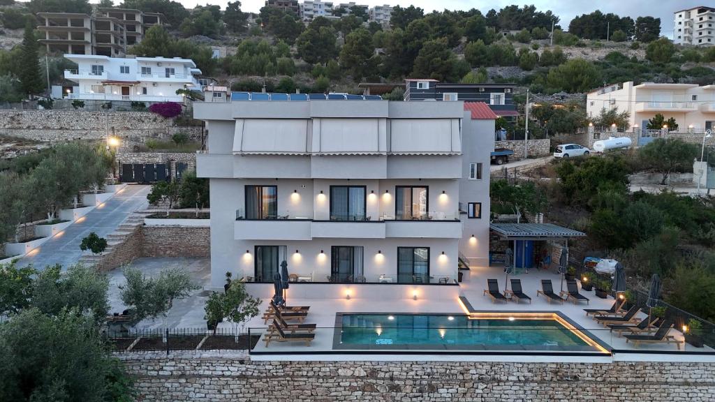 an aerial view of a house with a swimming pool at Safir Luxury Suites in Sarandë