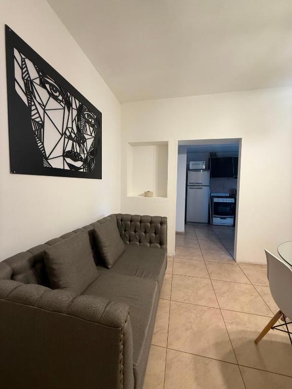a living room with a couch and a table at General Acha 869 in San Juan