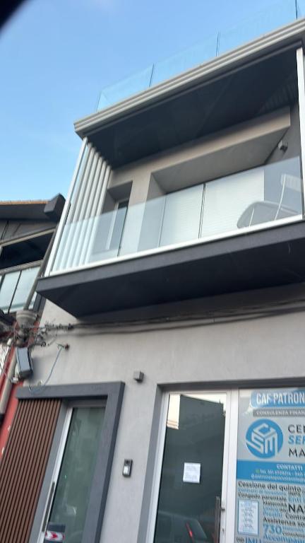 a building with a car valuation sign on it at AnnAmuri in Belpasso