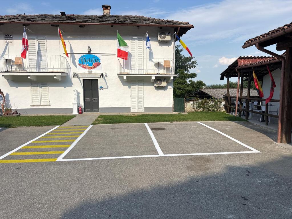 a tennis court in front of a building at Family in Envie