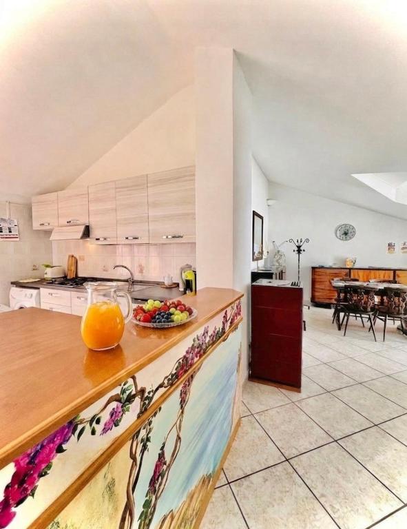 a kitchen with a bowl of fruit on a counter at Grandmother's Attic in Furore