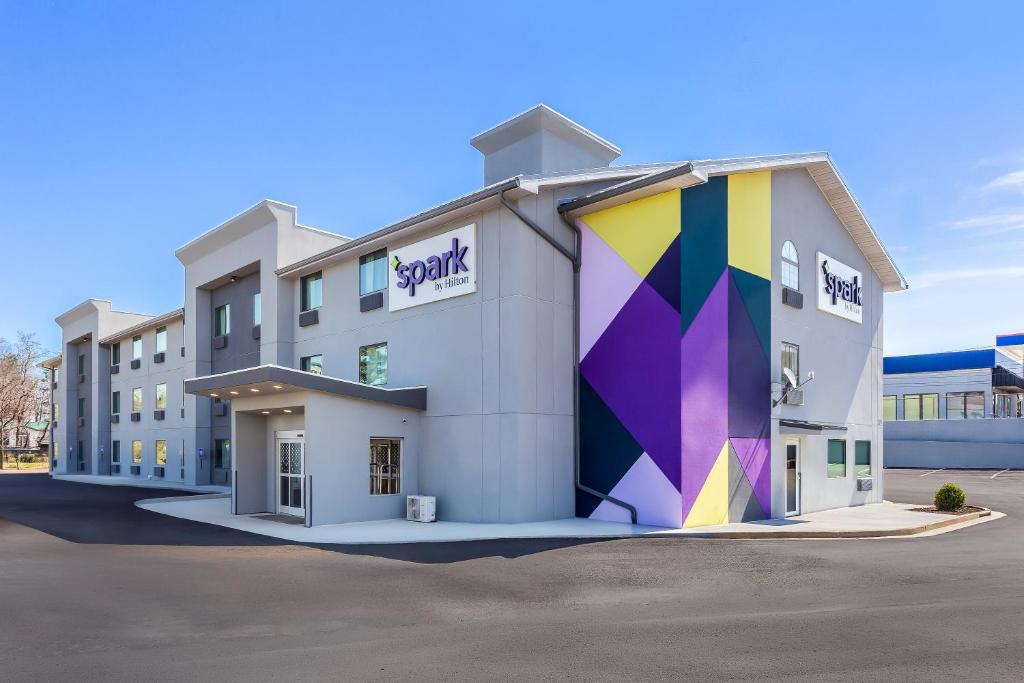 a building with a mural on the side of it at Spark By Hilton Beckley in Beckley
