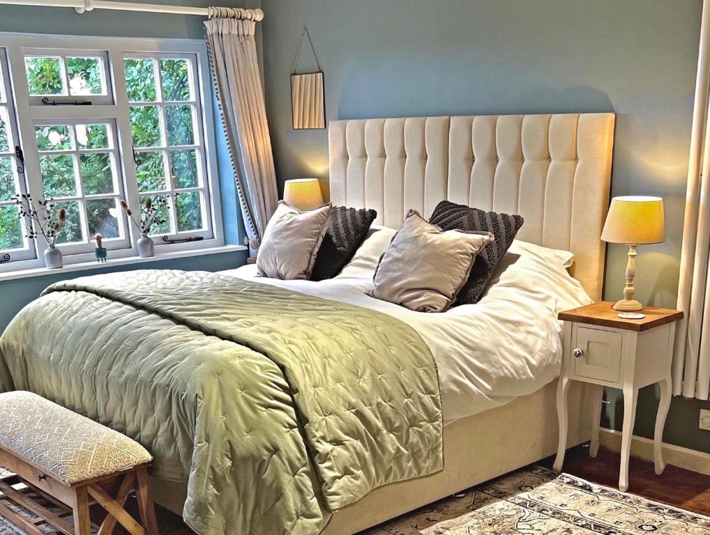 a bedroom with a large bed and a window at Heydon Private Guest Suite Self Check-in & Parking in Heydon