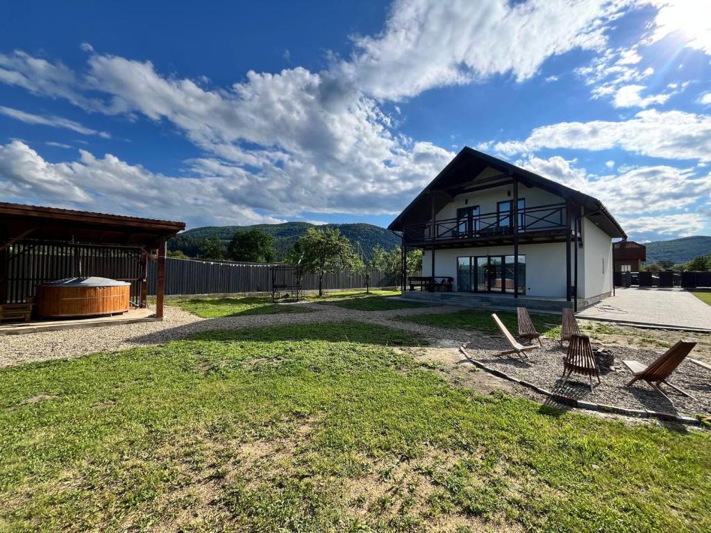 a house with a view of the mountains at Корчин Гарден Шале in Korchin