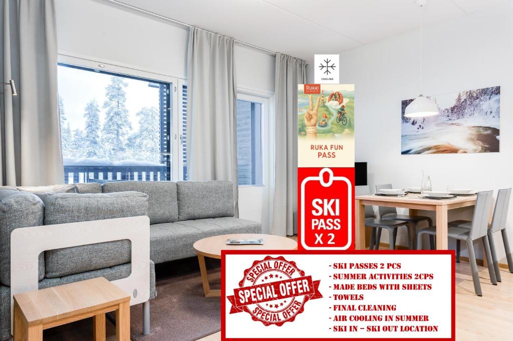 a living room with a couch and a table at RukaHillChalet5 Ski In - Ski Out - SkiPass & Summer activities x2 in Ruka