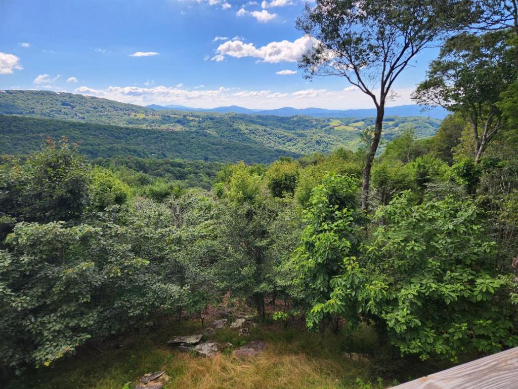 a view of a valley with trees and mountains at Resting on the Ridge in Beech Mountain
