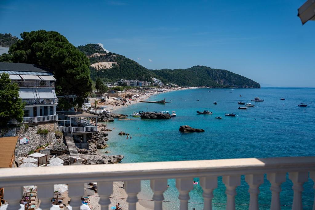 a view of a beach with boats in the water at Hotel Riviera Dhermi in Dhërmi