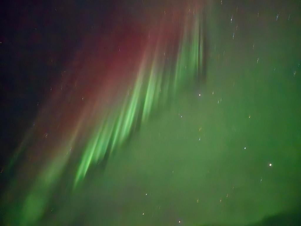 an image of the northern lights in the sky at Airport Central Apartment in Alta