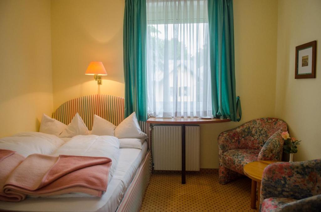 Postel nebo postele na pokoji v ubytování Gästehaus Pension Ria