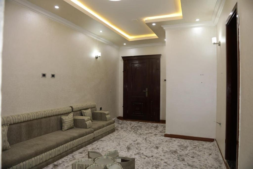 a living room with a couch and a table at kaf halal guest house in Addis Ababa