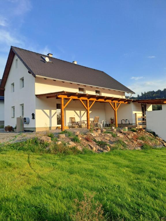 a large white house with a large yard at Sušice - prázdninový dům in Sušice