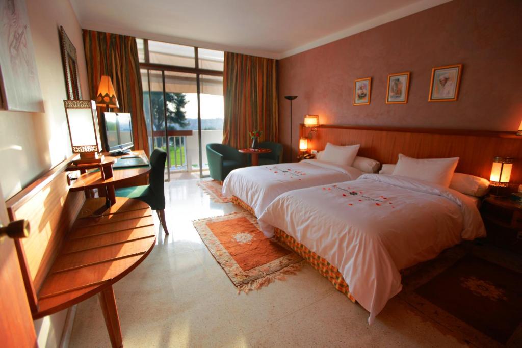 Postel nebo postele na pokoji v ubytování Hotel Transatlantique