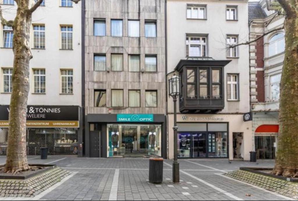 an empty street in front of a building at Downtown Apartment in Bonn