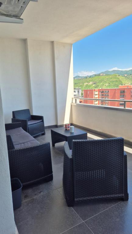 a room with chairs and tables on a balcony at Casa Mia in Cosenza