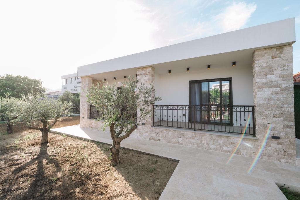 a rendering of a house with trees in front of it at Stanovic Bungalow in Ulcinj