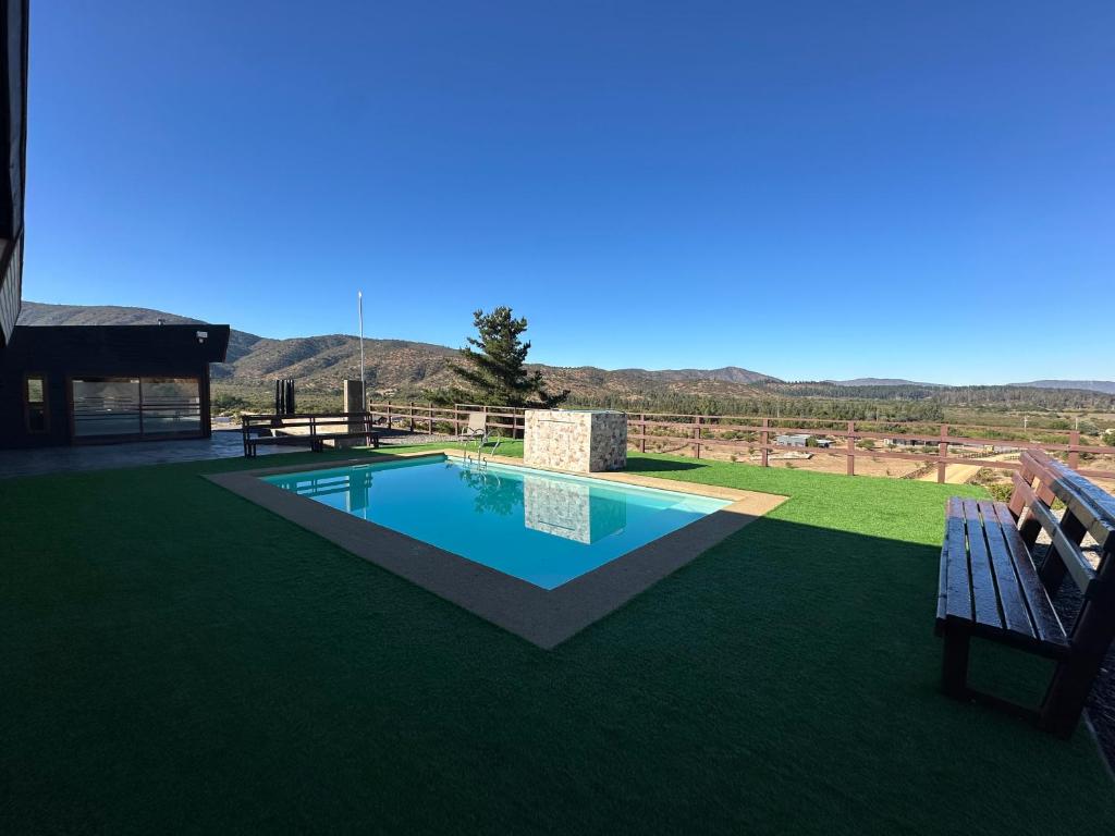 a swimming pool in a yard with a bench at Chalet Exclusive CasaBlanca in Casablanca