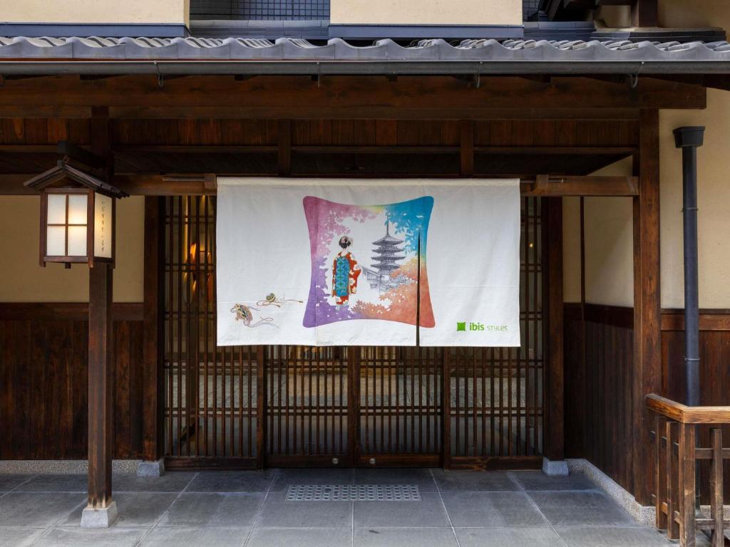 a large banner on the side of a building at ibis Styles Kyoto Shijo in Kyoto
