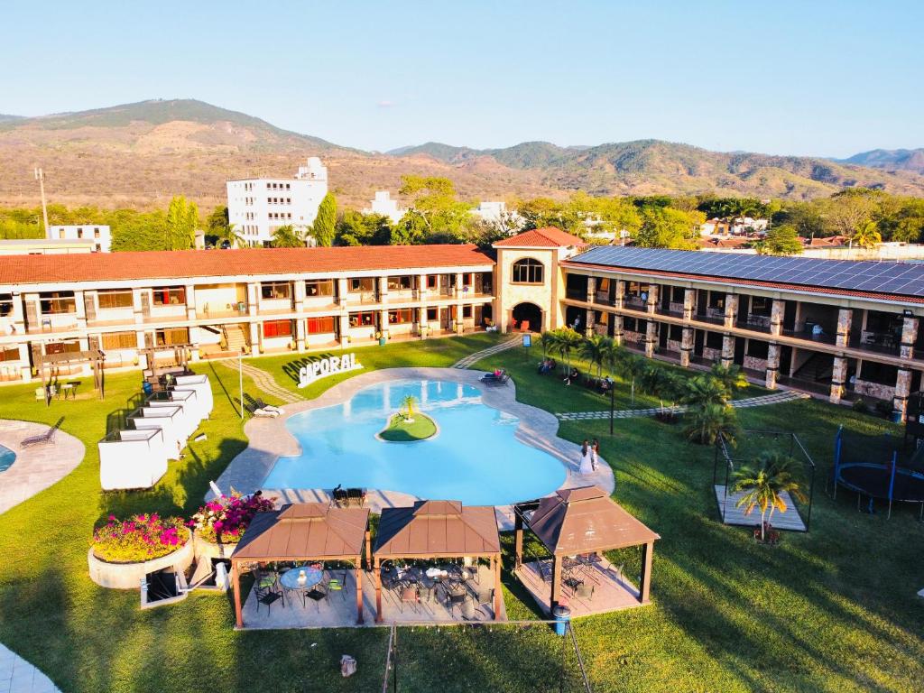 an overhead view of a building with a large swimming pool at Grand Caporal Hotel in Chiquimula