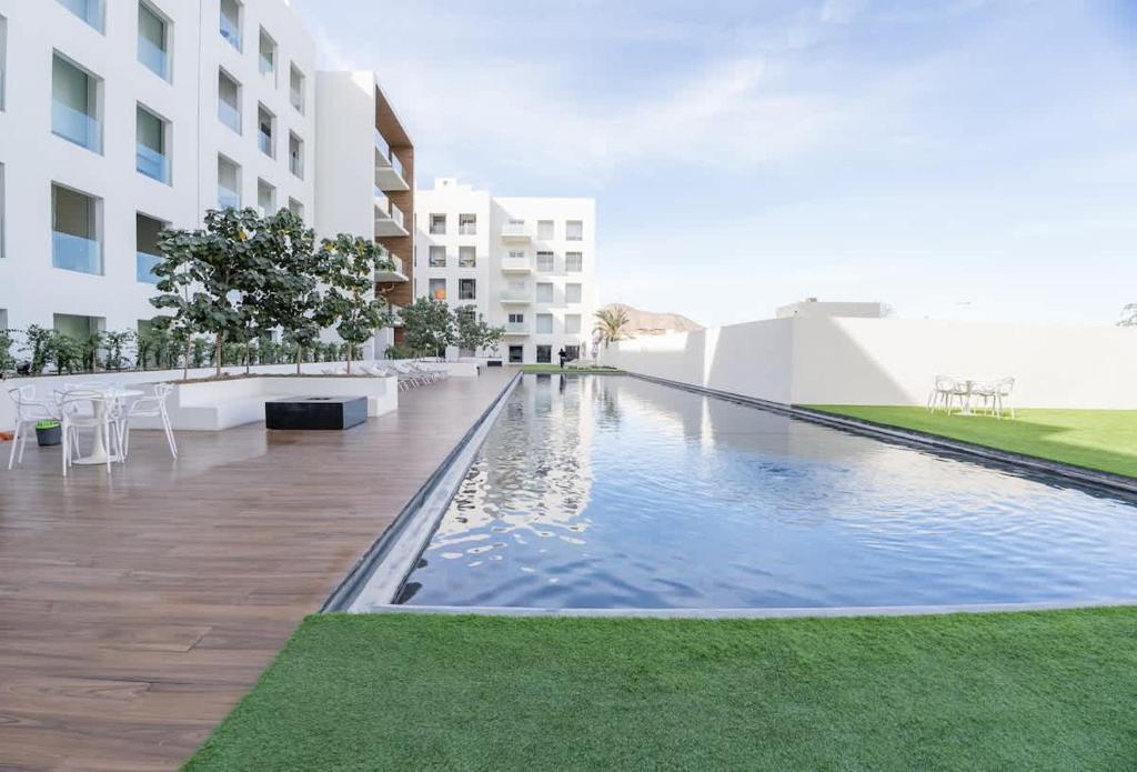a swimming pool in the middle of a building at 3BR Apartment Beach & Dining Steps Away in Cabo San Lucas
