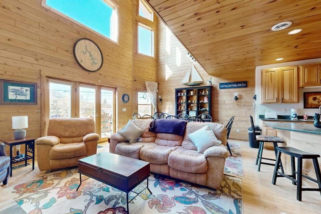 a living room with a couch and a table at Cedar Shores #15 in McHenry