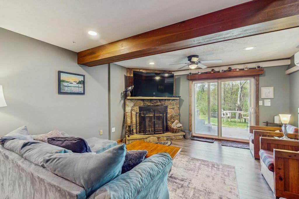 a living room with a couch and a fireplace at Ski Cove #2 in McHenry