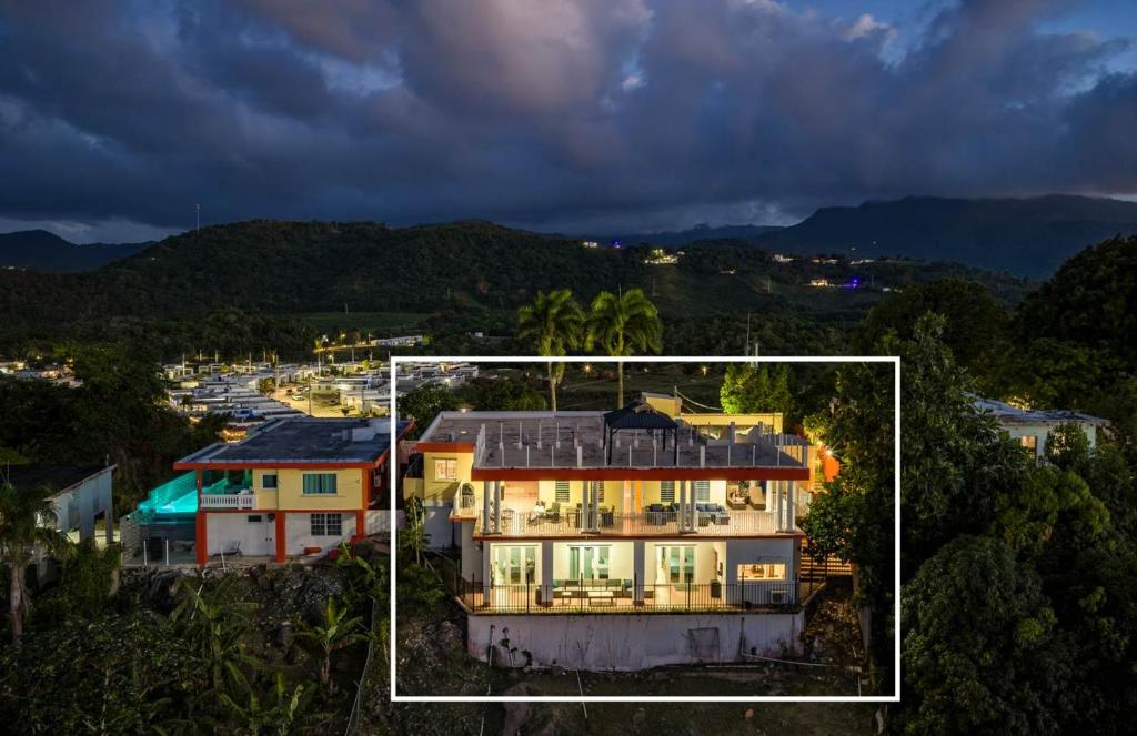 an aerial view of a house in a city at Villa del Enseuno- Pristine View and Infinity Pool in Luquillo