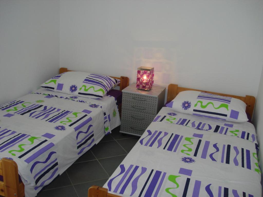 Postel nebo postele na pokoji v ubytování Sea Star Apartment