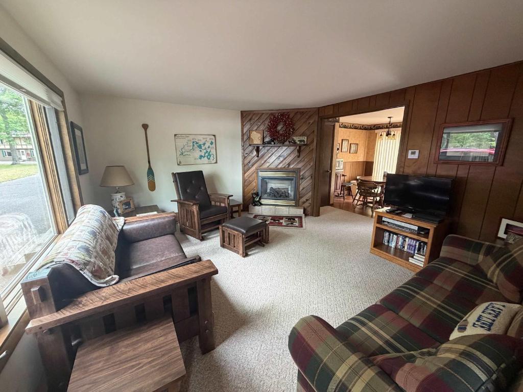 a living room with a couch and a television at Cleerwood Village #252 in Eagle River