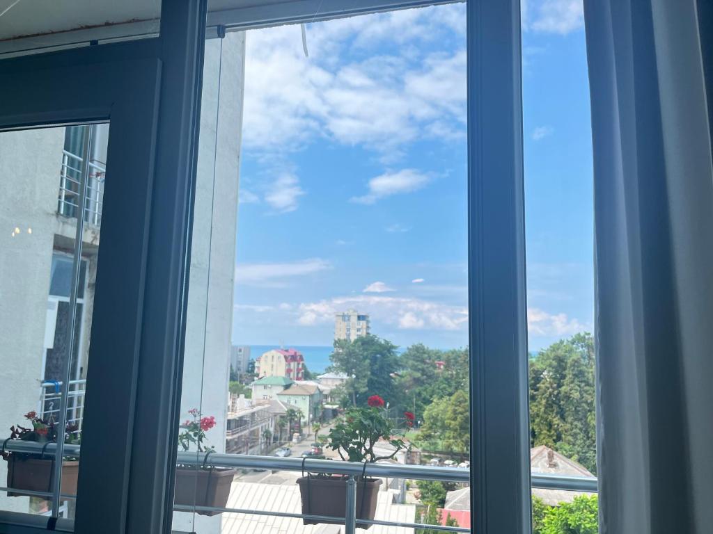 a view of a city from a window at kobuleti Apartment in Kobuleti