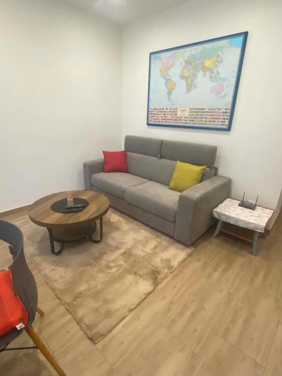 a living room with a couch and a table at Lo chalet sul lago in Ispra