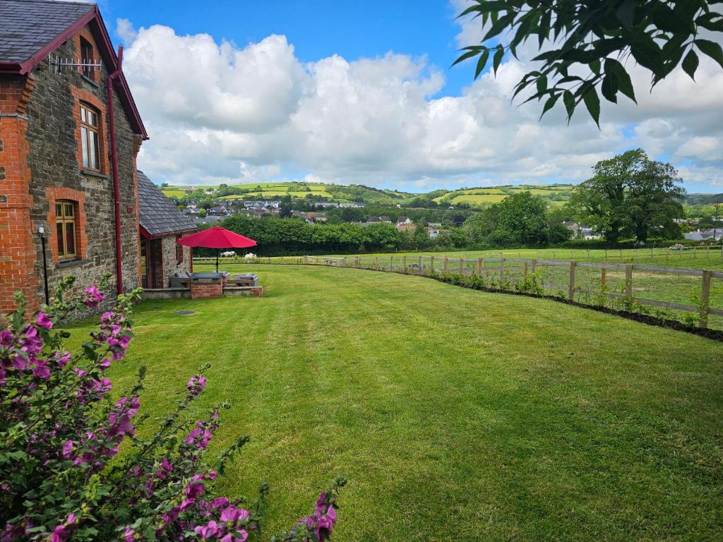 a large grassy yard next to a brick building at The Granary in Barnstaple