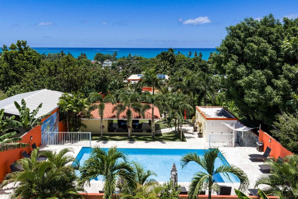 an aerial view of a resort with a swimming pool at Villa Jardin - Infinity Pool and Backyard Oasis in Luquillo