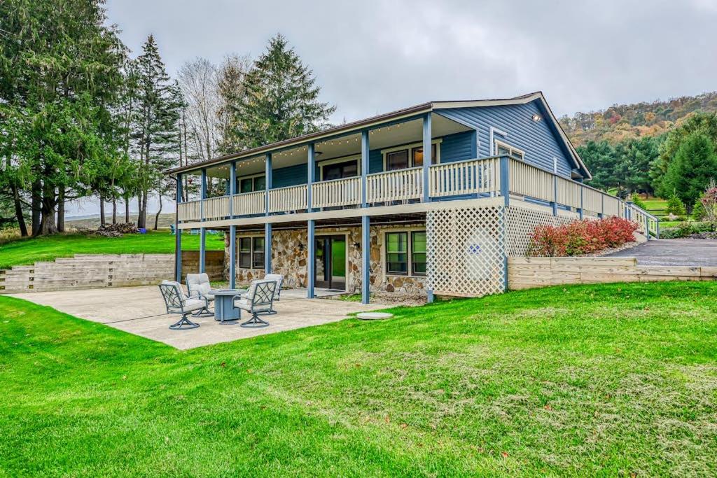 a large house with two chairs in a yard at Gleanings Pond in McHenry