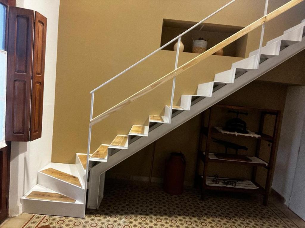 a spiral staircase in a room with a room at La Vicenta in Jesús María