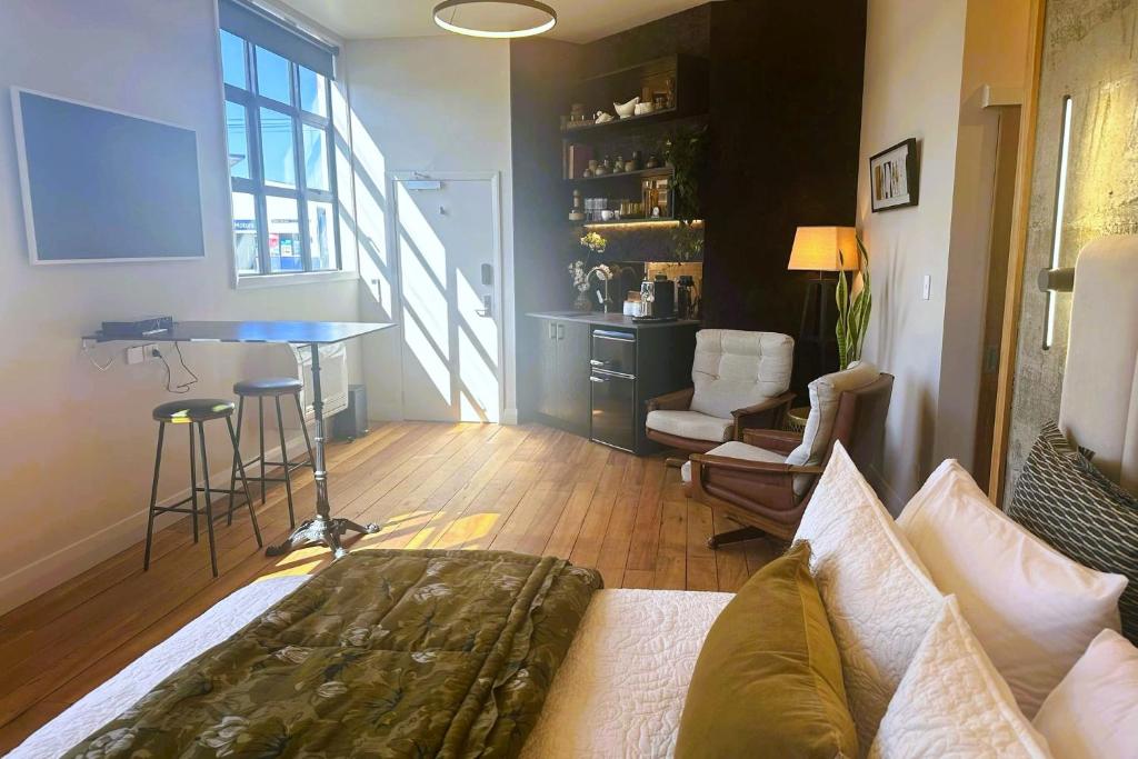 a living room with a couch and a table at The Advocate in Martinborough