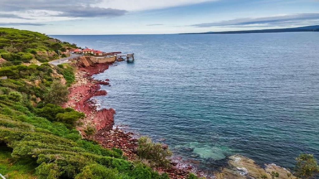 a view of the ocean from a cliff at Bantry Two in Merimbula