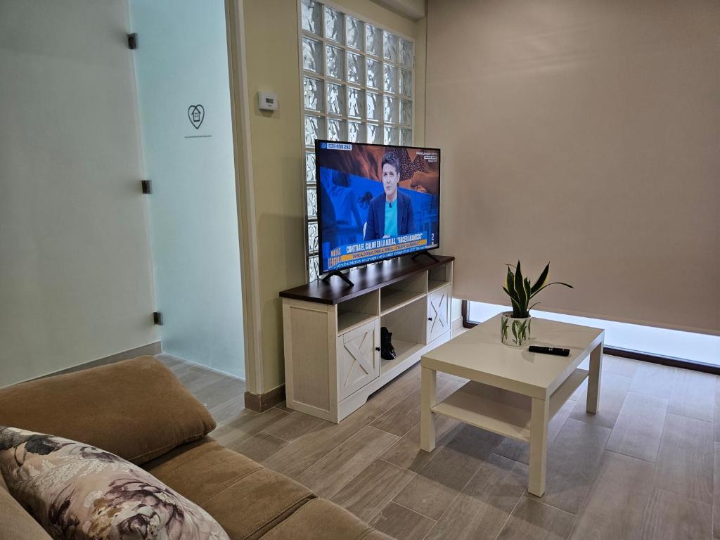 a living room with a large flat screen tv at la herencia B VUT 1693 in Ponferrada
