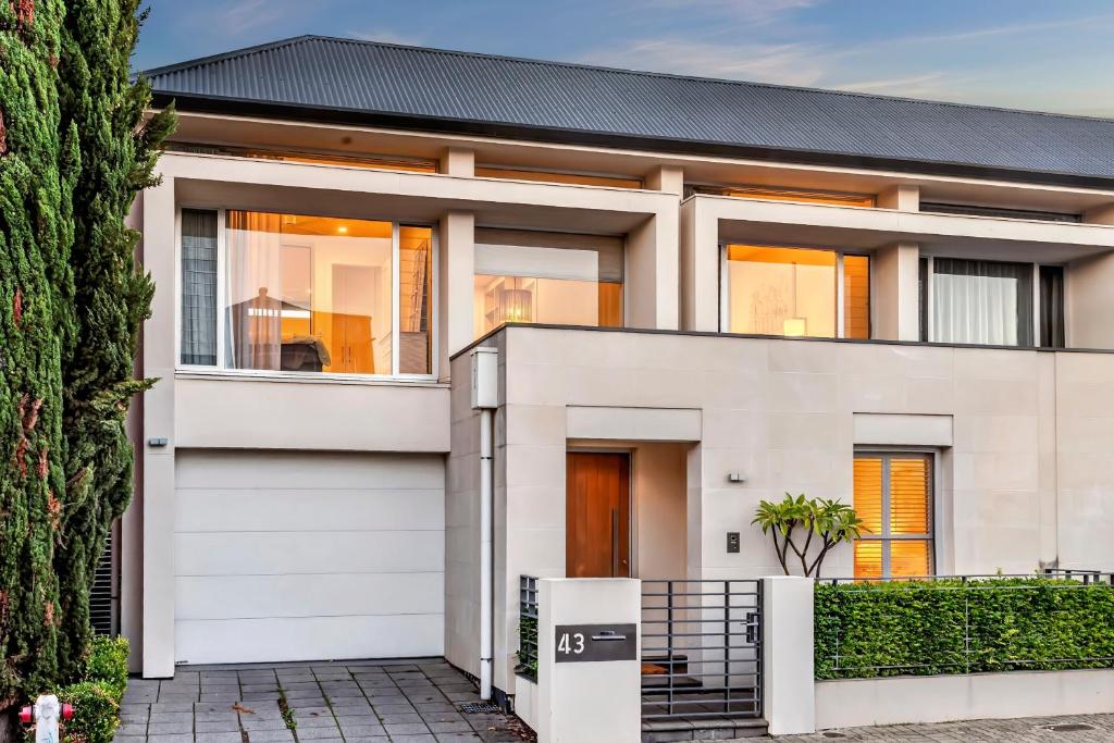 a white house with a black roof at Margaret House | Elegant City-Fringe Escape in North Adelaide