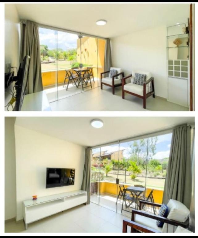 a living room and a dining room with a fireplace at Flat 705 Winterville - Gravatá in Gravatá