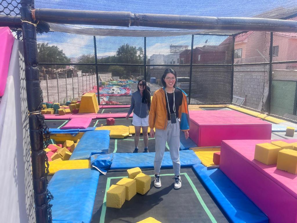two women standing in an indoor play structure at hostal y centro de eventos in Chorrillos