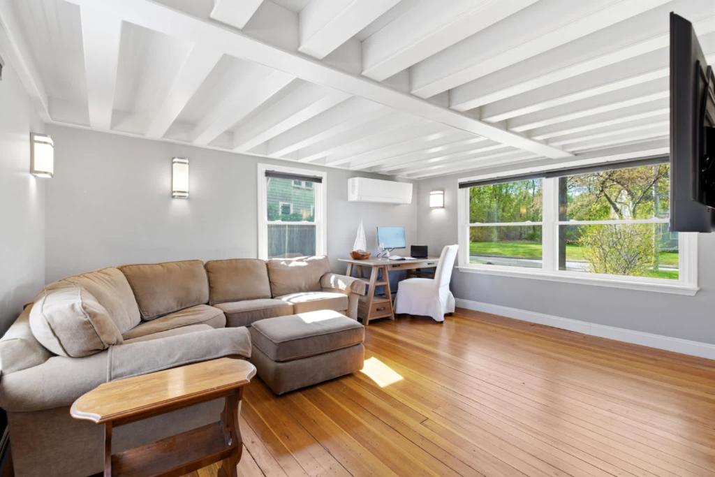 a living room with a couch and a table at Crosswinds Near Beach & Shops in Kennebunk