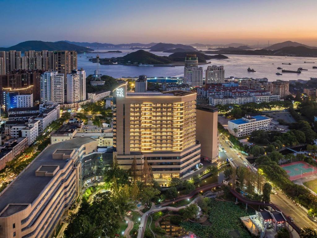 an aerial view of a city at night at NOVOTEL Zhoushan Luting in Zhoushan