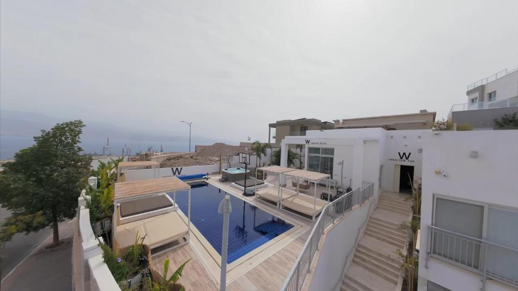 an aerial view of a house with a swimming pool at Villa Vibes Eilat Villa 26 - 8 bedrooms with private pool in Eilat