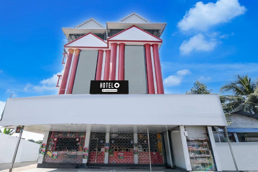 a building with red pillars on top of it at Hotel O Eastern Crossway Siliguri Formerly Utsho in Siliguri