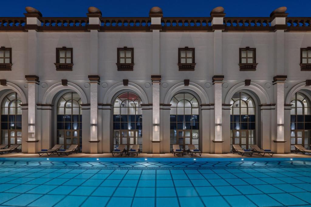 an image of a building with a pool at Oaks Ibn Battuta Gate Dubai in Dubai