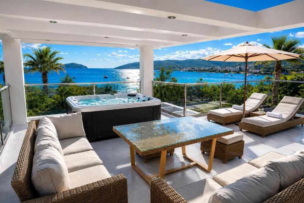 a living room with a couch and a table at Allure villa in Porto Rafti