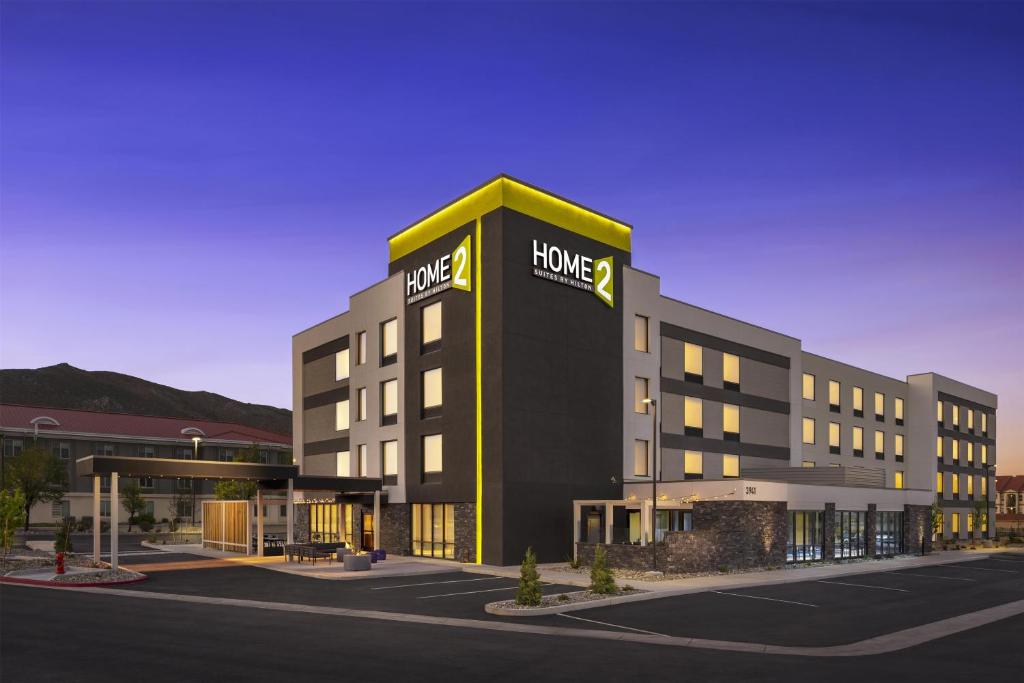 a hotel with a sign on the side of a building at Home2 Suites By Hilton Carson City in Carson City